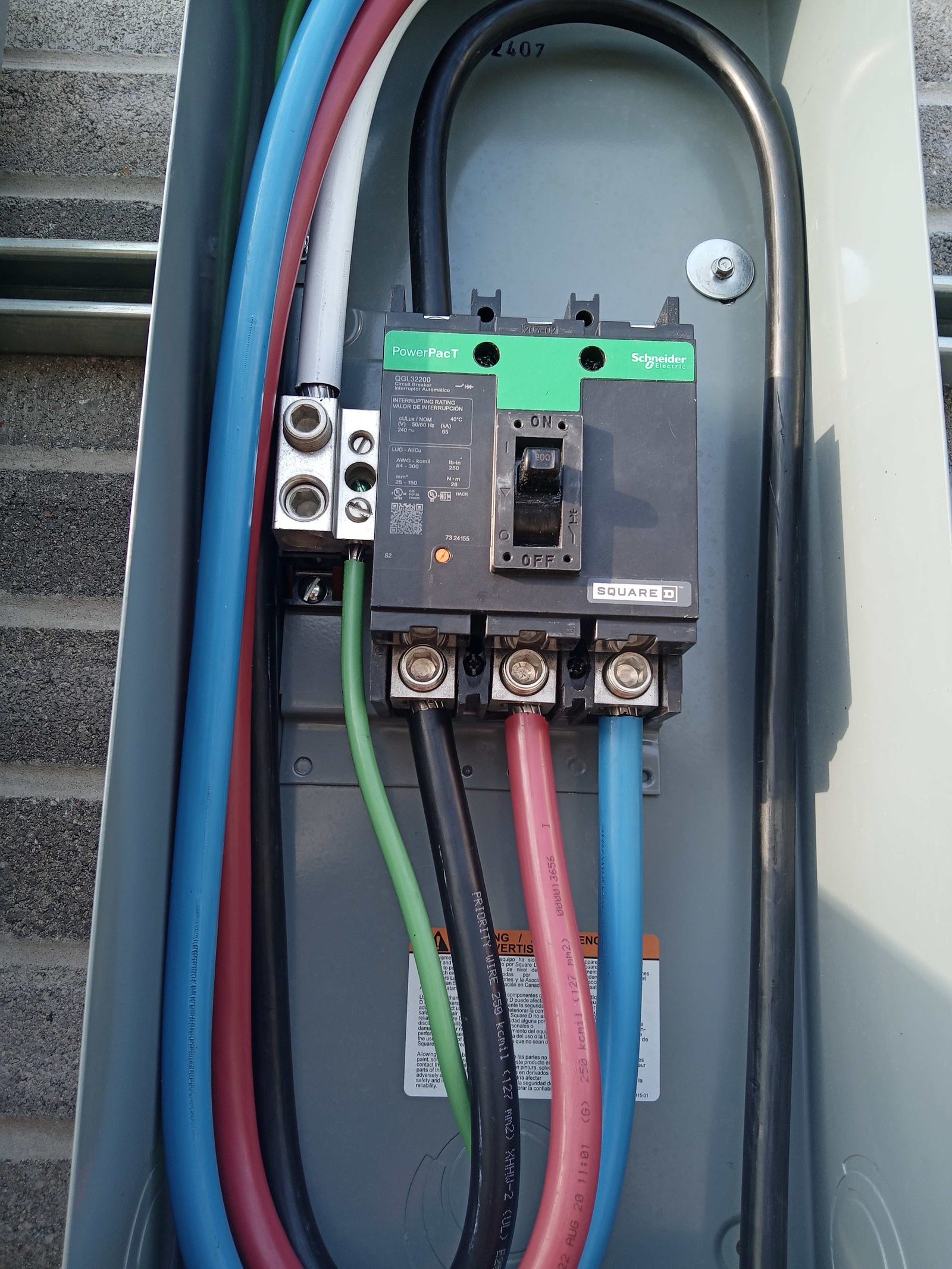 Feeder conductors terminated on a molded case breaker inside commercial equipment