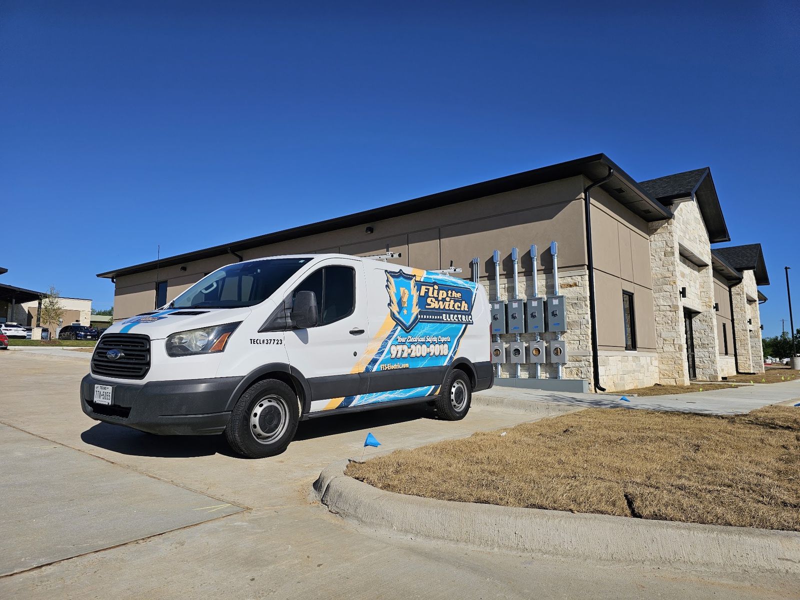 Flip the Switch Electric service van parked at a commercial job site